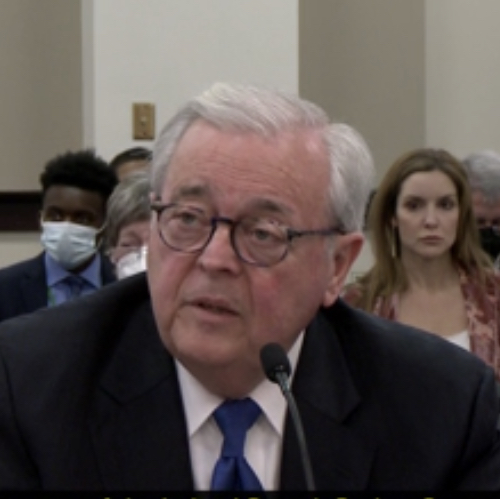 Chief Justice John Minton testifies in a legislative committee meeting