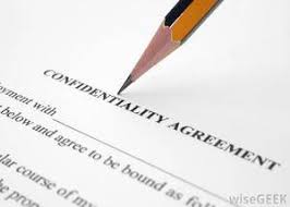 Photo of a pencil pointing to a confidentiality agreement 