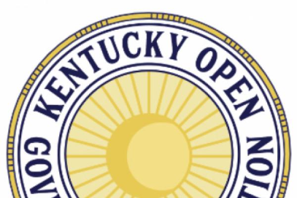 The Kentucky Open Government Coalition seal depicts a sun encircled by the name Kentucky Open Government Coalition